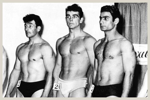 Young Sean Connery posing in a bodybuilding competition