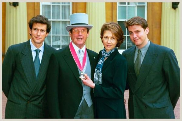 Roger Moore with his family after being Knighted in 2003