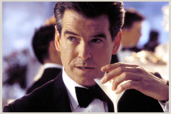 Shaken not stirred, Pierce Brosnan looking cool with a martini as James Bond