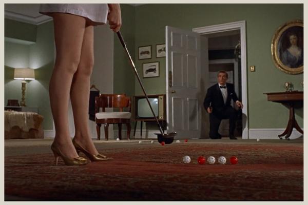 Sylvia Trench playing with Bond's golf clubs