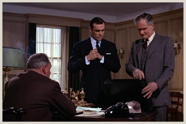 Bond, Q and M discuss the mission in From Russia with Love