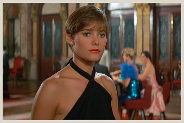 Carey Lowell as Pam Bouvier, the ex-Army pilot, and DEA informant that helps Bond in Licence to Kill